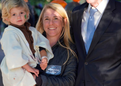 Friends of Rose Park - Halloween 2018 - photo with man and a woman holding a child close up