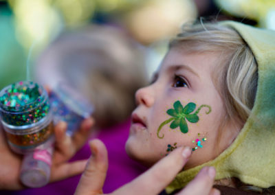 Friends of Rose Park - Halloween 2018 - child getting face paint and glitter