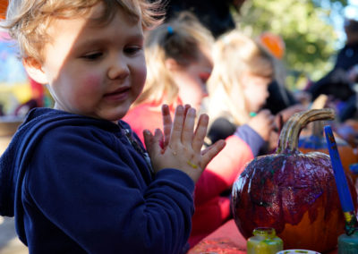 Friends of Rose Park - Halloween 2018 - child painting pumpkin